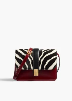 Khaite Crossbody Bags-Blake Crossbody Bag in Zebra Print Haircalf and Oxblood Leather