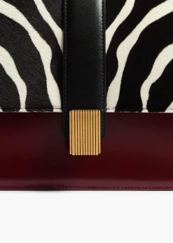 Khaite Crossbody Bags-Blake Crossbody Bag in Zebra Print Haircalf and Oxblood Leather