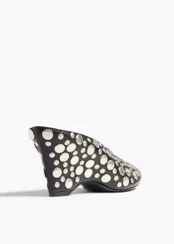 Khaite Mules-Cloak Wedge in Black Leather with Silver Studs