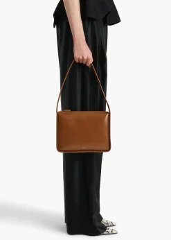 Khaite Shoulder Bags-Lori Squared Bag in Dark Honey Crackle Patent Leather