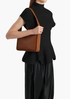 Khaite Shoulder Bags-Lori Squared Bag in Dark Honey Crackle Patent Leather