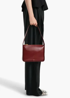 Khaite Shoulder Bags-Lori Squared Bag in Oxblood Crackle Patent Leather