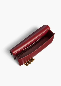 Khaite Evening-Sculpted Hand Clutch in Oxblood Leather
